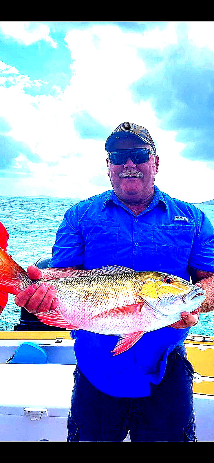 Angler holding a large snapper