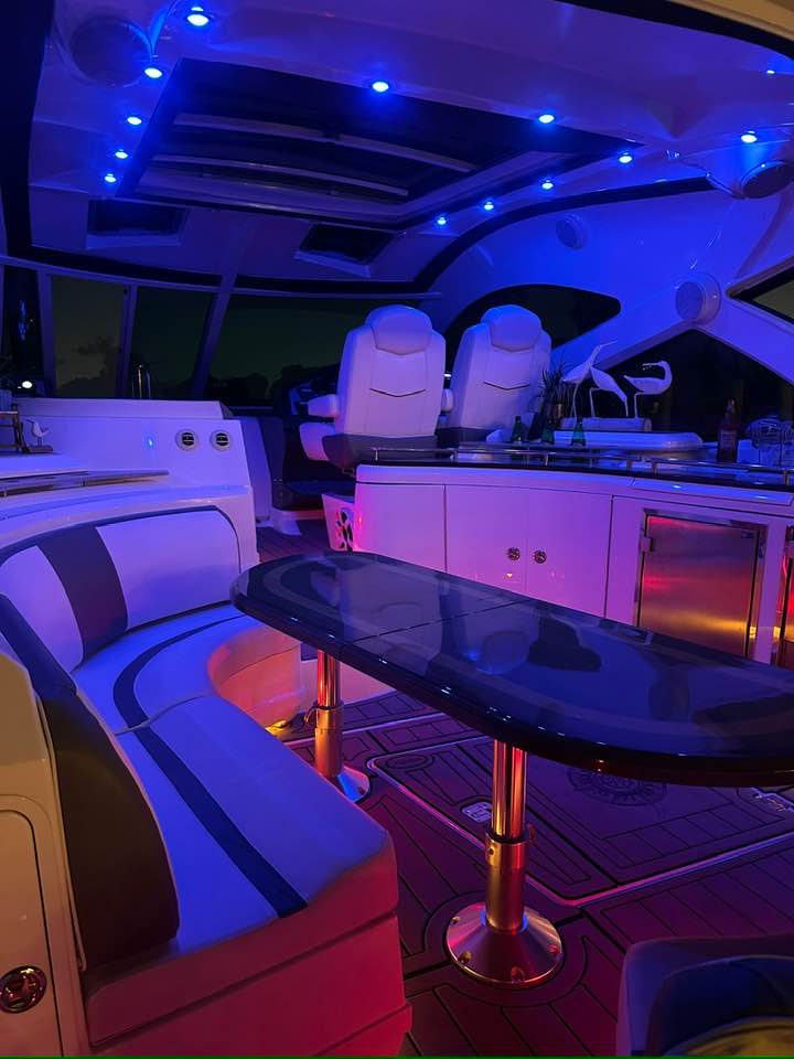 Cruiser Yachts 60 aft lounge with custom LED bar and wet deck setup