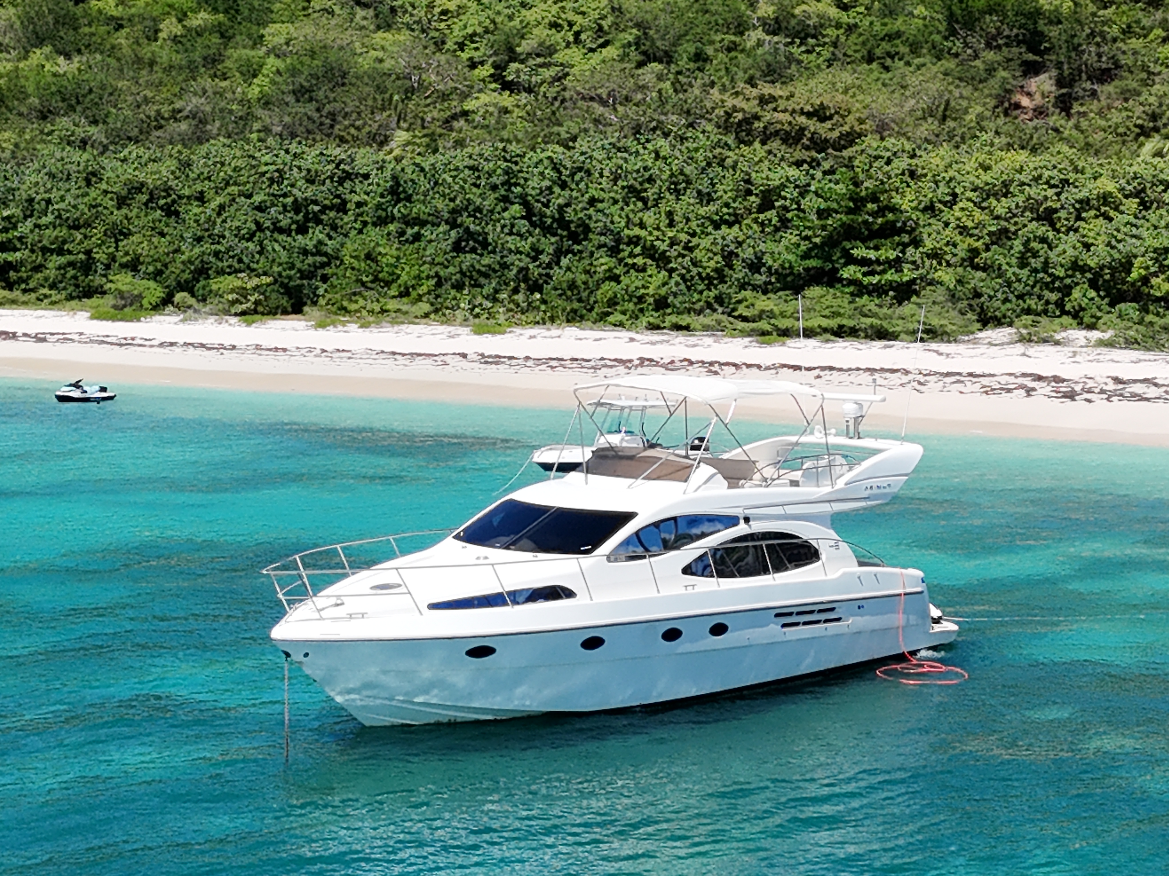 Aerial of Azimut yacht anchored at green island beach