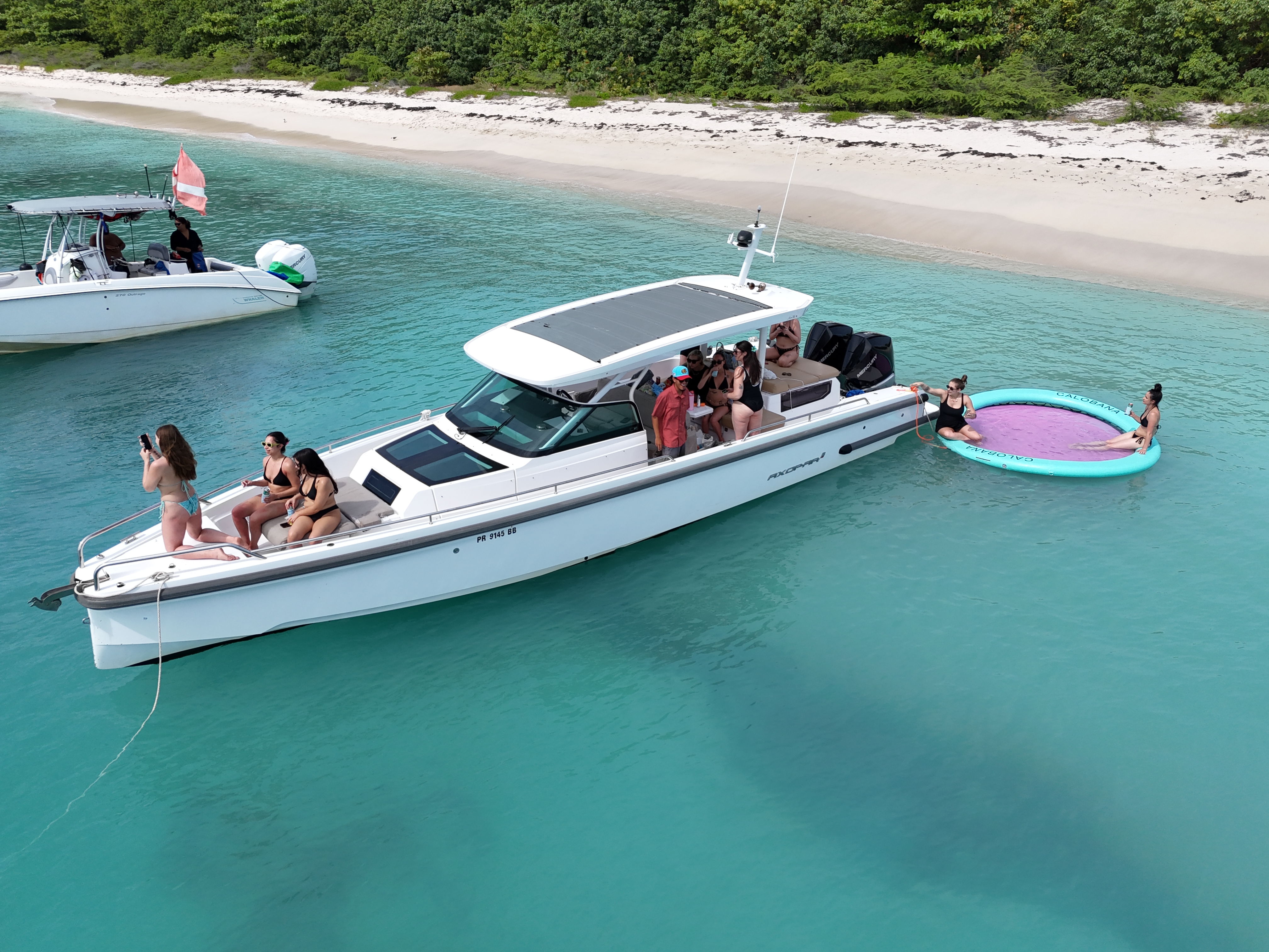 Aerial of Axopar with guests and Calobana floating mat at sandbar