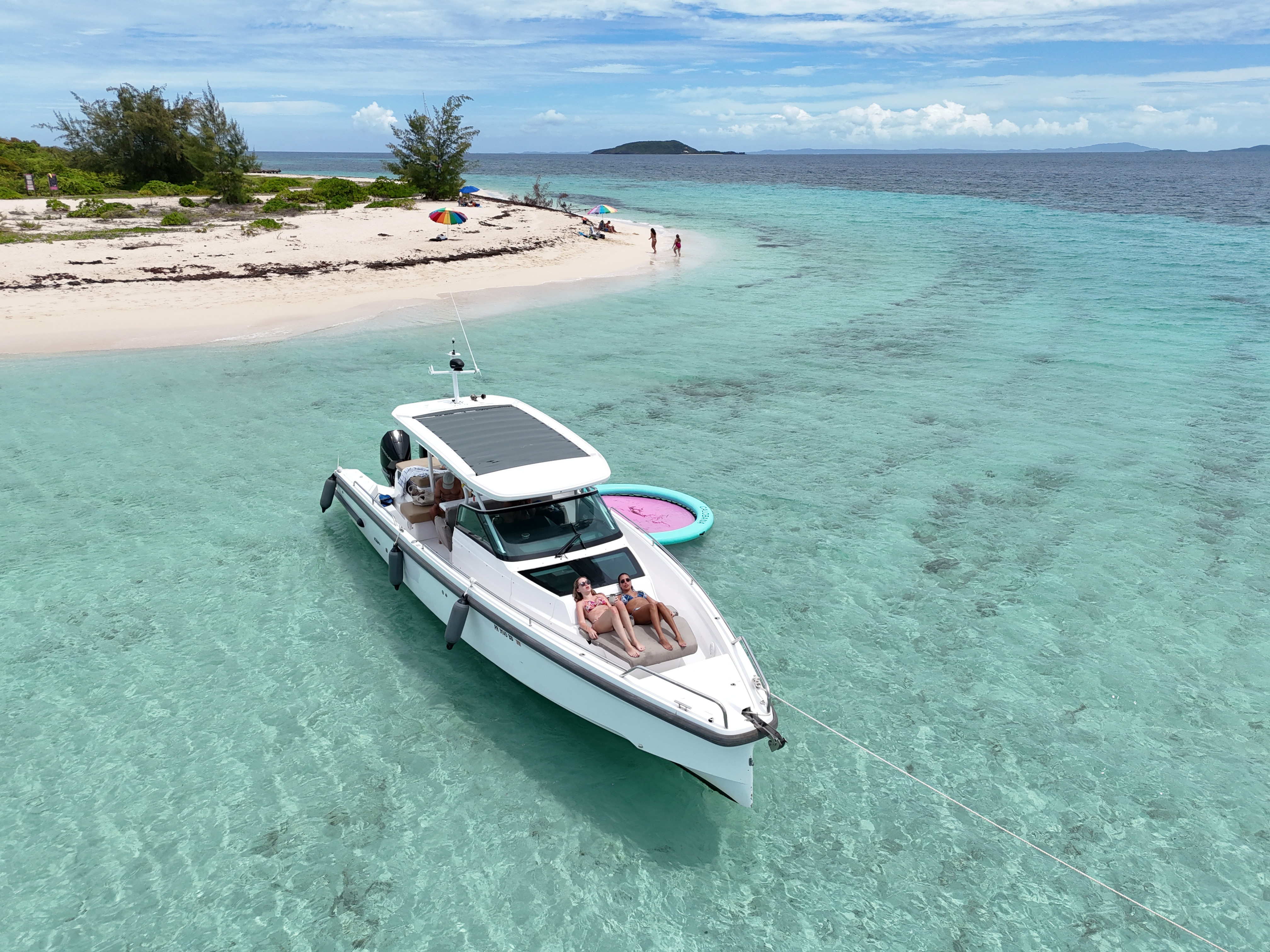 Aerial drone view of Axopar yacht anchored at private sandbar in Puerto Rico