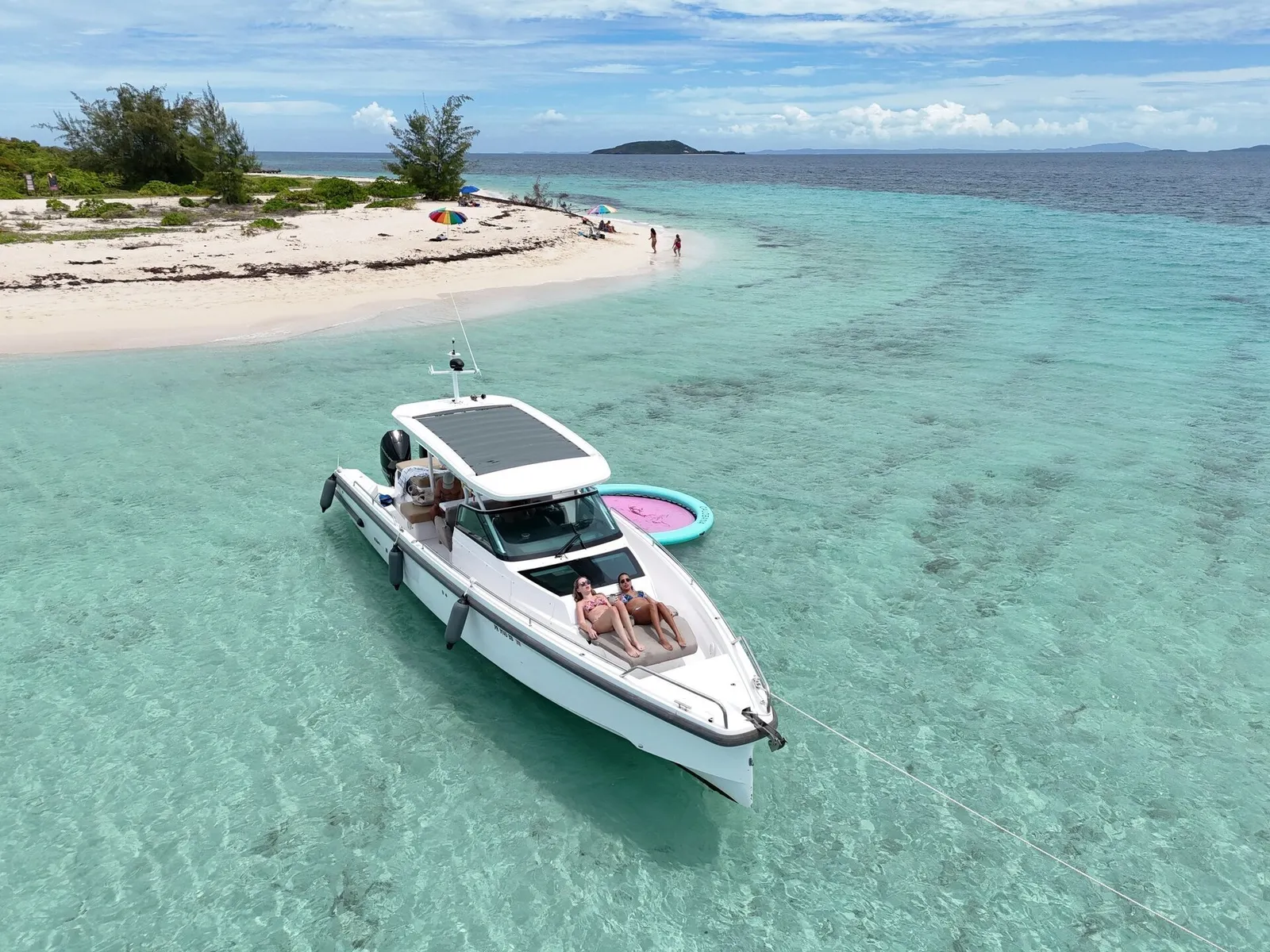 Aerial drone view of a private boat charter in the turquoise water off Puerto Rico