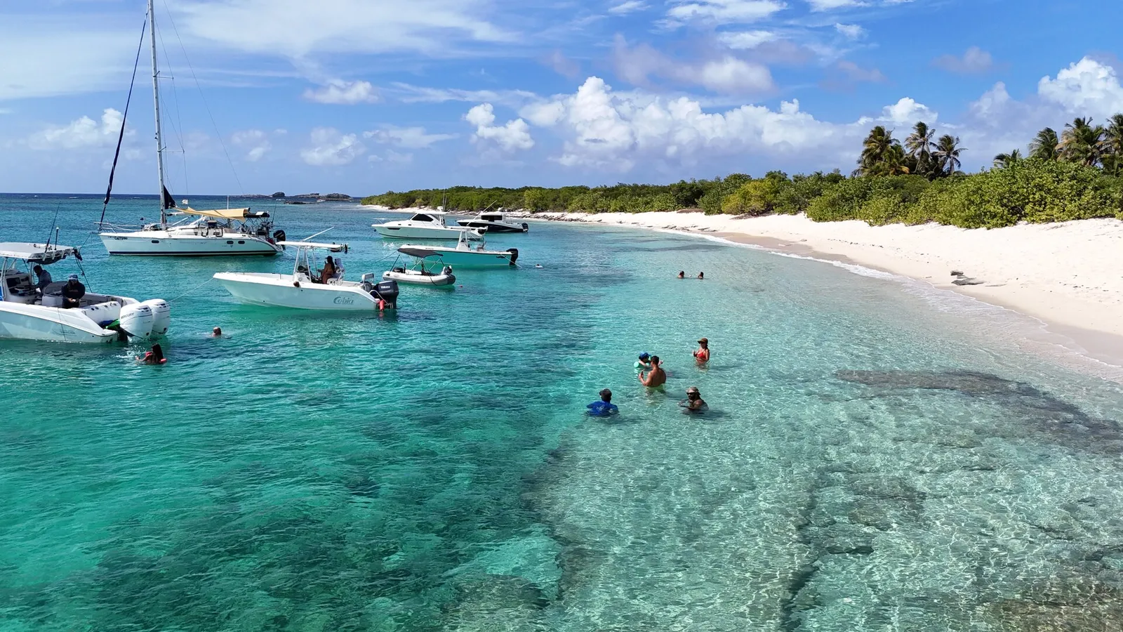 Aerial drone view of Cayo Icacos sandbar with anchored boats, Puerto Rico