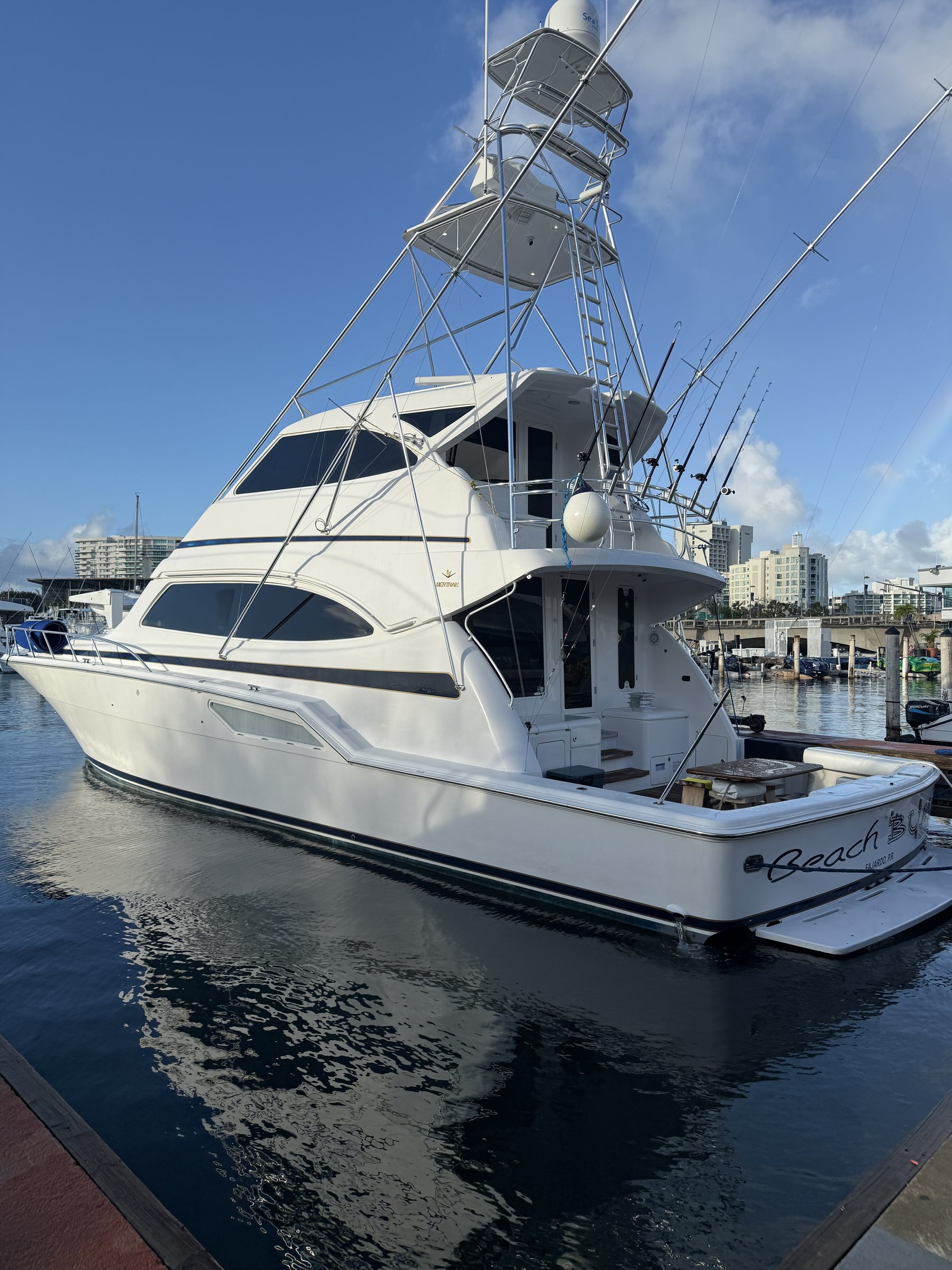 Bertram 70ft sportfisher docked at San Juan Bay Marina with Old San Juan in the background
