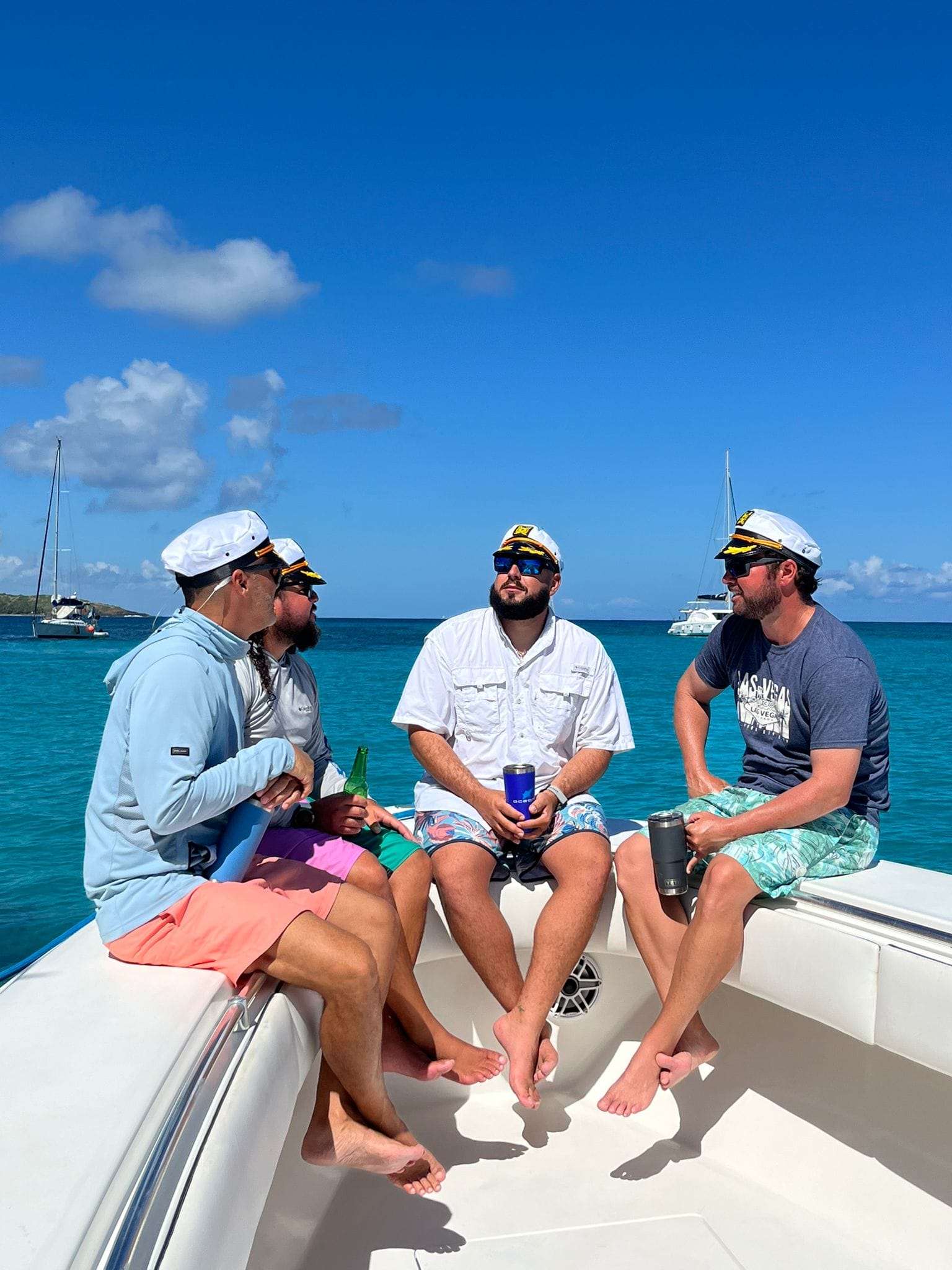 Charter guests on a boat in Fajardo, Puerto Rico, with crystal-clear water in the background