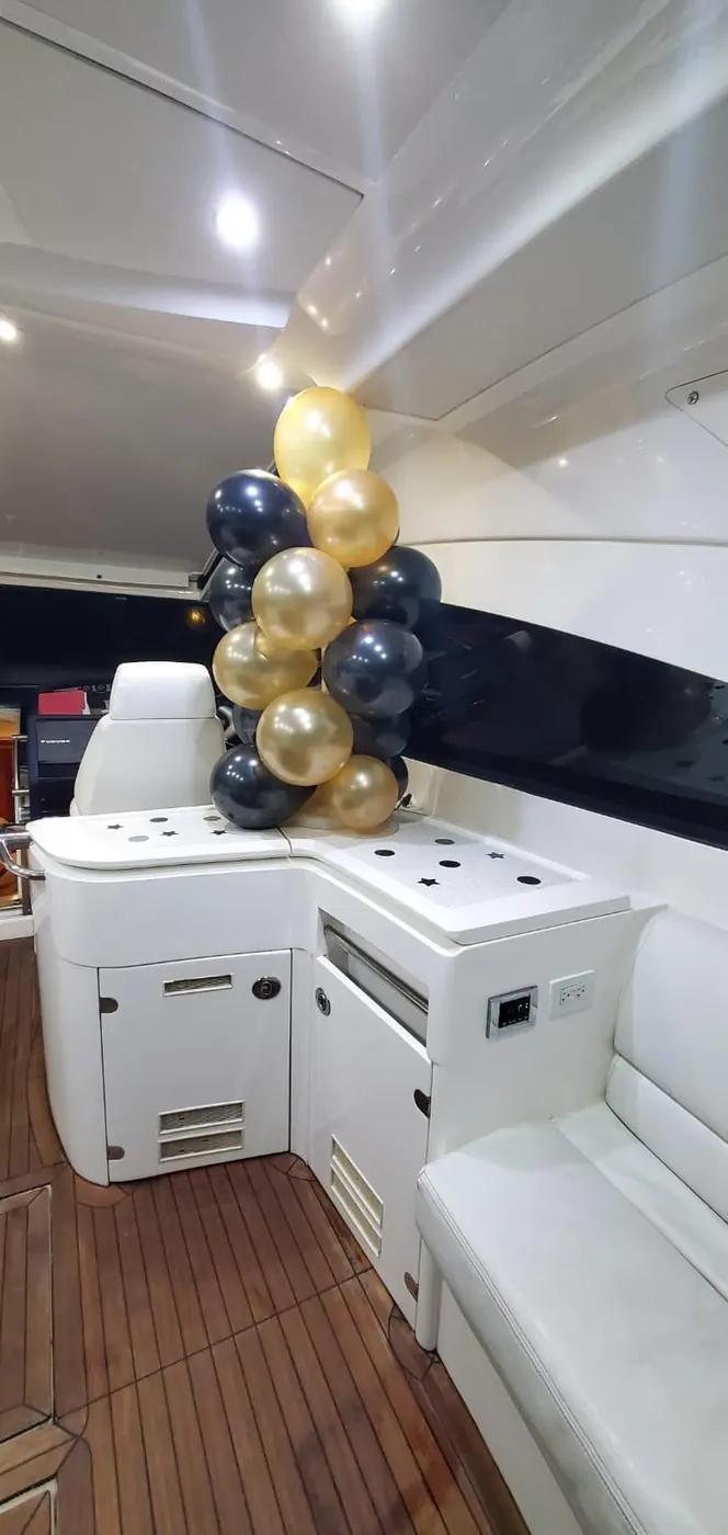 Black and gold balloon column decoration onboard a yacht in Puerto Rico