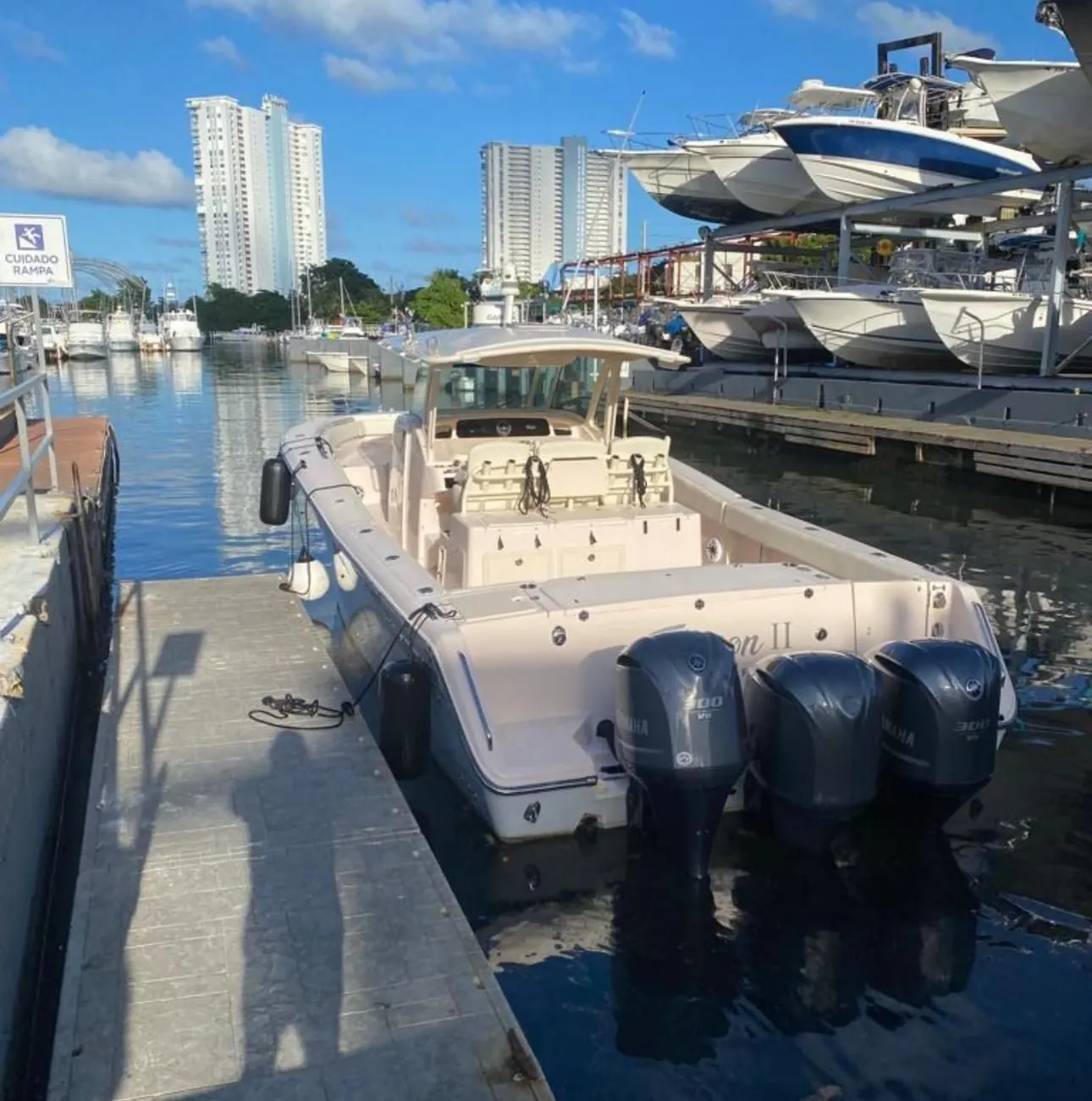 Grady White 38 docked with triple Yamaha 300 outboards
