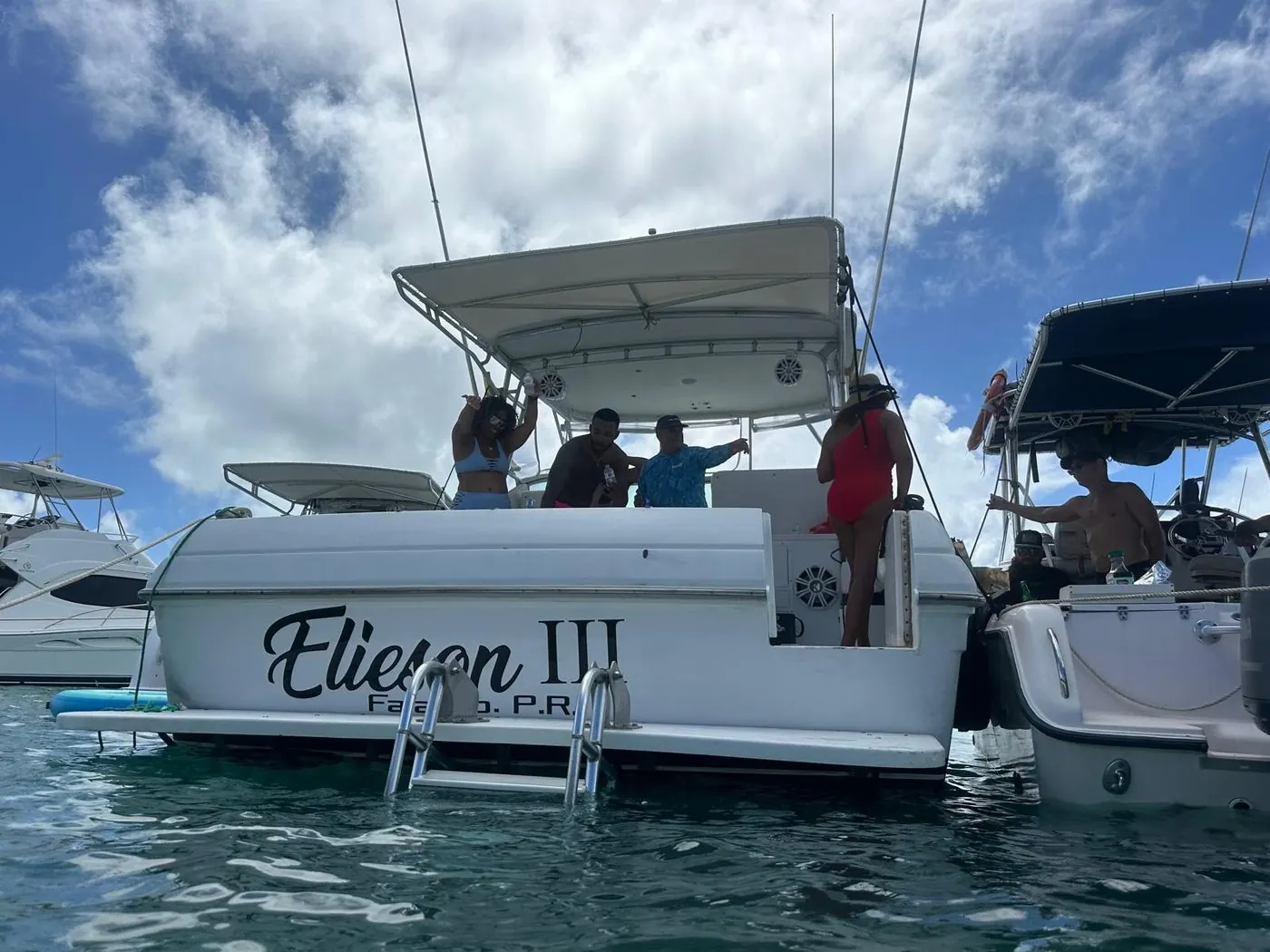 Group celebrating on the stern with music
