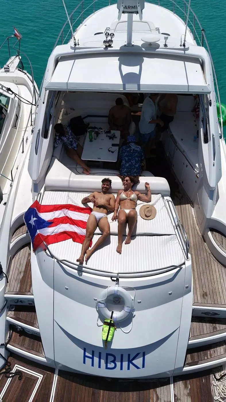 Guests sunbathing on bow with Puerto Rican flag
