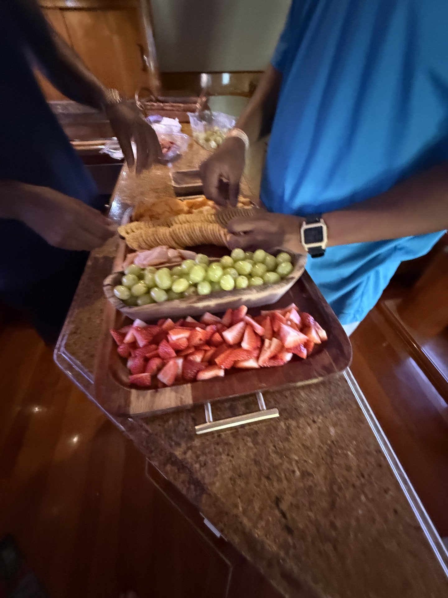 Crew preparing a fresh fruit and snack tray for a Boating Puerto Rico charter