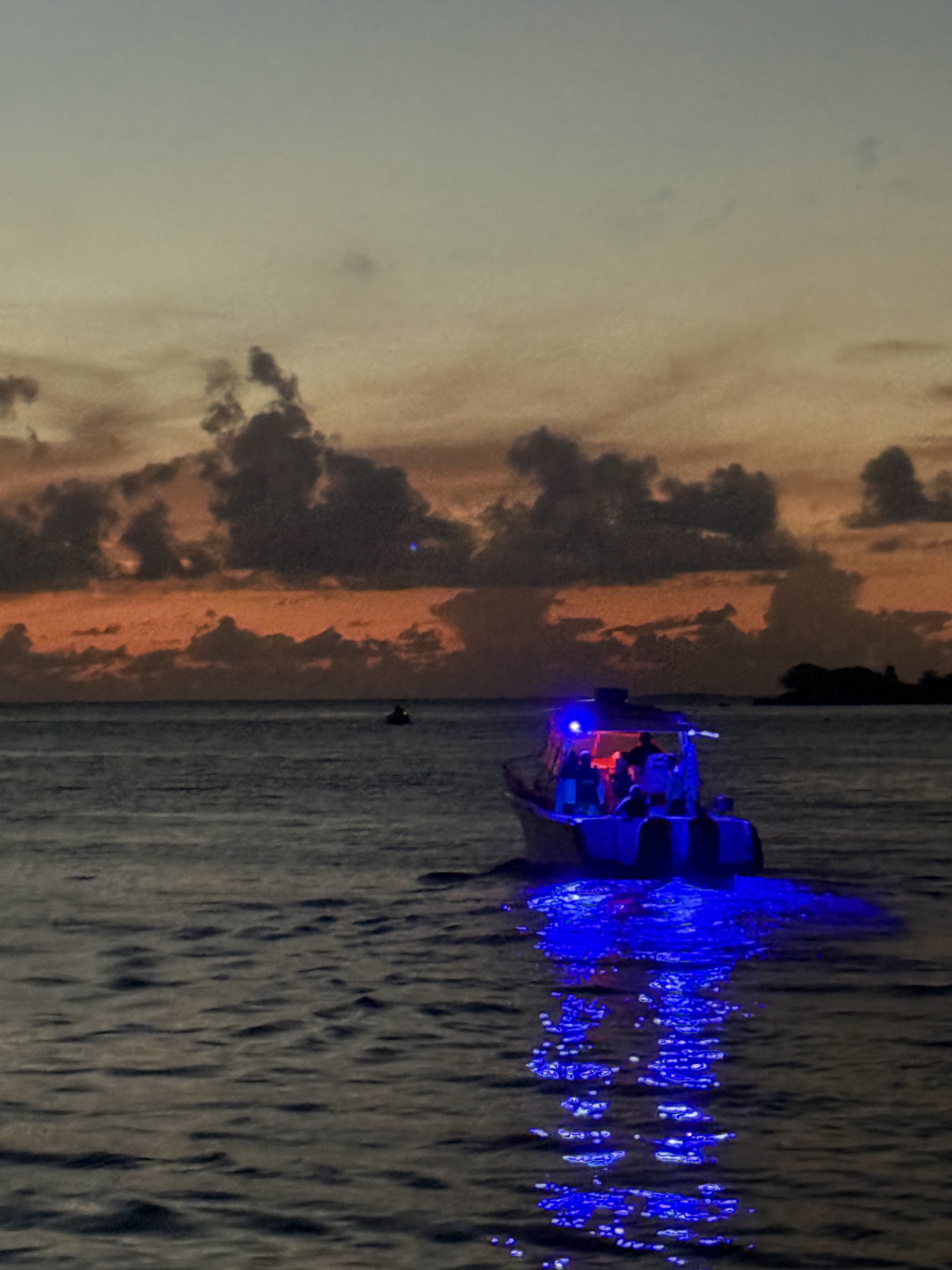 Bow of a charter boat heading toward sunset off Fajardo coast